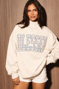 "BLESSED" GRAPHIC LONG SLEEVE MOCK NECK SWEATSHIRT